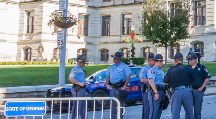 Trooper recruitment and retention becoming a problem Trooper recruitment: Georgia state troopers stand in street outside the Georgia Capitol building behind a street barrier.