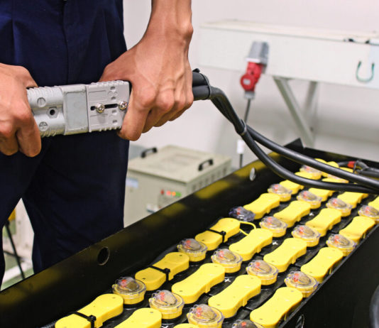 Georgia’s debate over election bills, the state’s energy usage and extracurricular activities for home-schoolers Energy: Closeup of person's hands connecting high-voltage plug in plant sanding in front of multiple battery bank