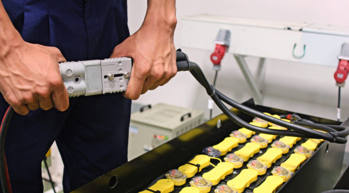 Georgia’s debate over election bills, the state’s energy usage and extracurricular activities for home-schoolers Energy: Closeup of person's hands connecting high-voltage plug in plant sanding in front of multiple battery bank