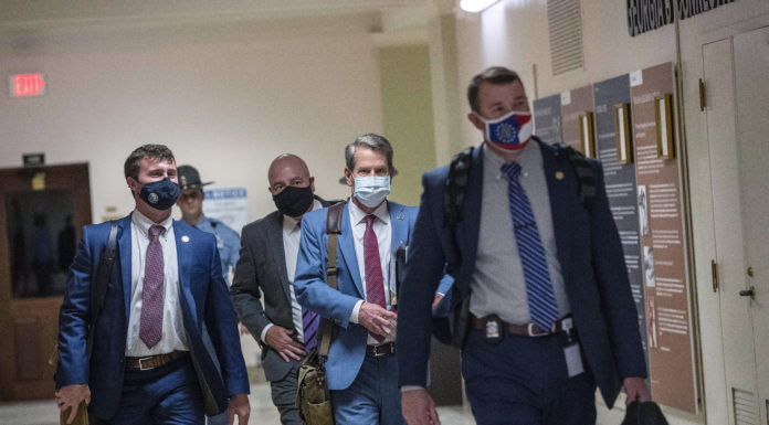 Georgia Gov. Kemp signs GOP election bill amid an outcry Georgia Gov. Brian Kemp