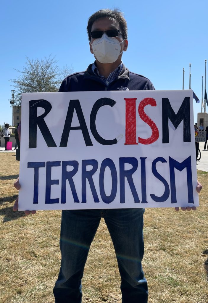 Faming Li joins protestors Saturday, March 20, 2021 at Liberty Plaza in downtown Altanta, Georgia to demonstrate against anti-Asian hate in response to the mass shooting that killed eight people including six women of Asian decent.
