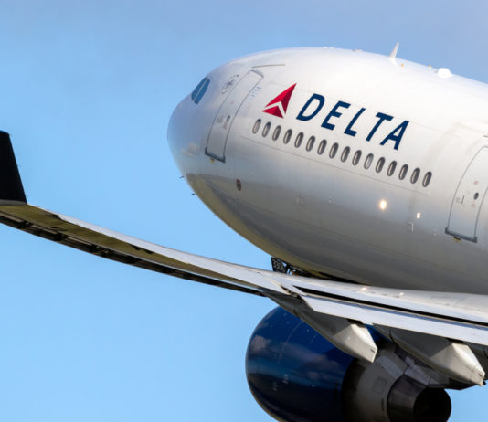 Corporations gave over $50M to voting restriction backers Closeup of Delta airplane taking off in clear blue sky