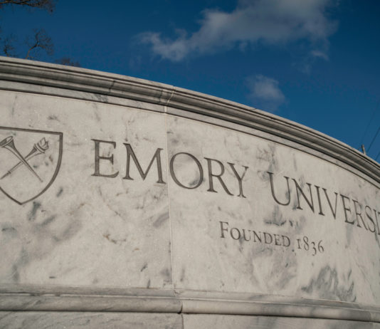 5 private Georgia colleges to require vaccines for students Emory University stone sign with school shield and founding date 1836
