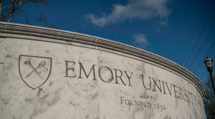 5 private Georgia colleges to require vaccines for students Emory University stone sign with school shield and founding date 1836