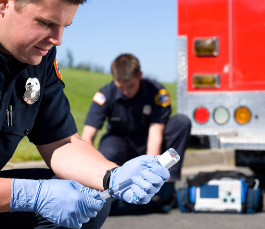 New Georgia law allows paramedics to administer a lifesaving shot paramedics preparing hypodermic to administering a shot