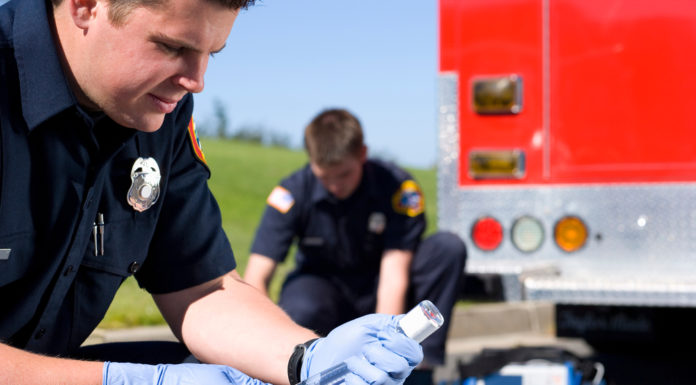 New Georgia law allows paramedics to administer a lifesaving shot paramedics preparing hypodermic to administering a shot