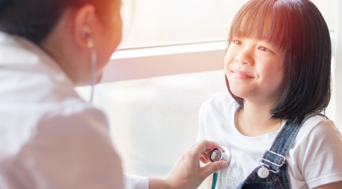 Medicaid plays key role in Georgia’s challenge to insure kids and adults alike Professional general medical pediatrician doctor in white uniform gown listen lung and heart sound of Asia child patient with stethoscope: Physician check up Asian kid female after consult in hospital