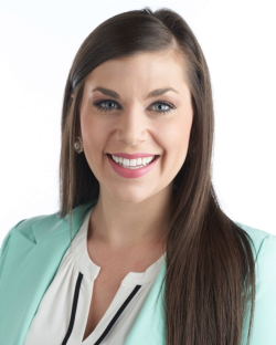 FTG Team: Chelsey Tabakian Odom headshot woman with long dark hair wering mint green suit jacket and white blouse smilin into camera on white background