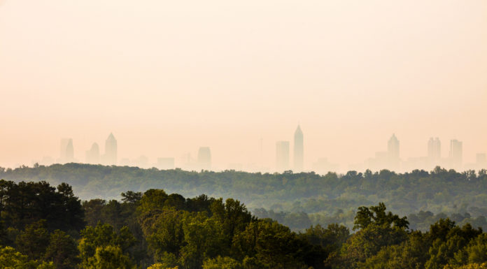 Possible cityhood movement in Cobb poses challenges for residents aerial photo with dense trees and Atlanta skyline in the background