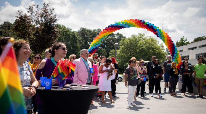Gwinnett County officially recognizes Pride Month for the first time Crowd of people standing in front of rainbow ballons