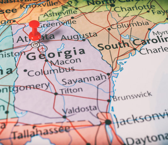 Lawmakers are preparing for the upcoming redistricting process map of the state of Georgia with red pin in Atlanta