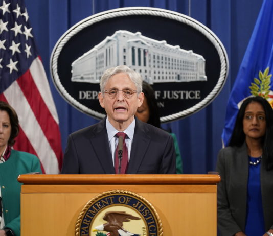 Justice Department suing Georgia over state’s new voting law Attorney general merrick garland at podium in front of white house seal