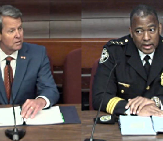Law enforcement aired complaints during Georgia House committee hearing Gov. Brian Kemp white man in gray suit and tie with blonde hair(left) and Chief of Police Todd Coyt (right - black man in navy blue police uniform (right) sit at table with paperwork both facing camera
