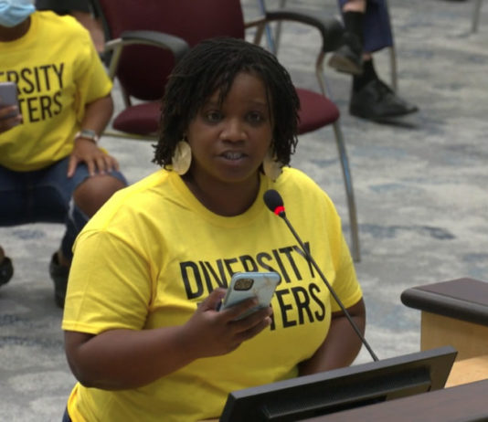 Georgia teachers voice concerns over critical race theory bans Black woman speaking at podium