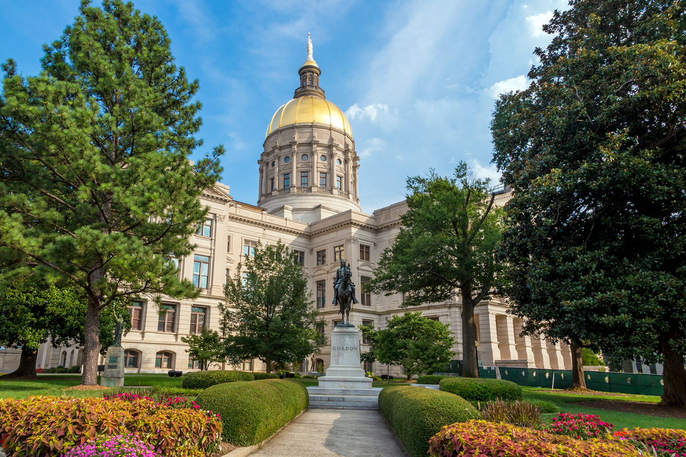 Black women politicians: Georgia state Capitol with a gold dome and surrounded by green trees
