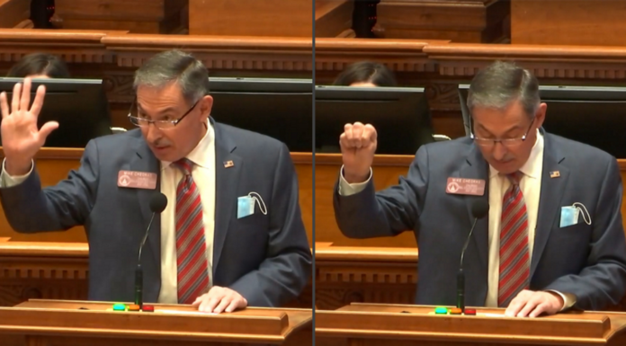 Georgia Representative shares hand signal that alerts danger Signal for Help: Side-by-side picture ofGrey haired man in grey suit sitting at wood deck with raised right hand raised. In left side shwing th open palm psotion and right side showing closed fist position of the Signal for Help.