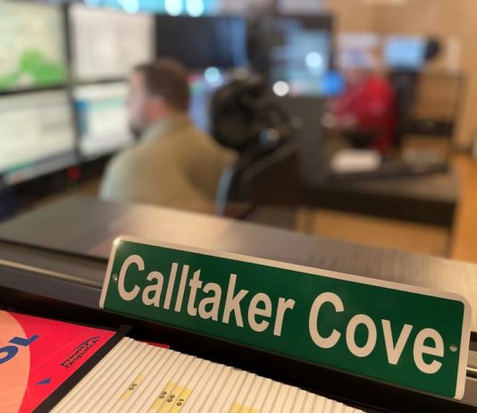 988 will be the ‘911’ for mental health/addiction crisis calls. Georgia preps for the extra load. a green sign on an office desk that has Calltaker Cove in white writing on it
