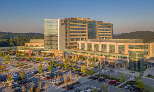 Anthem names new chief in Georgia amid dispute with Northside Arieal view of Northside Hospital with the sun setting and reflecting off the building