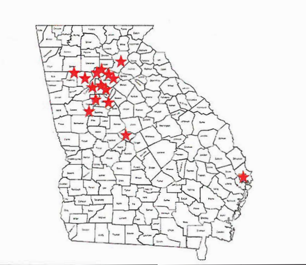 black outline of the state of Georgia with small red stars covering multiple counties in Atlanta.