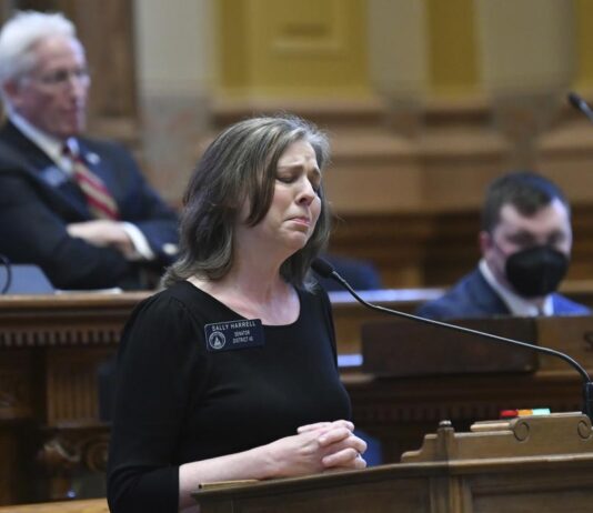 Ban on transgender sports passes despite appeal from senator White women at a podium crying