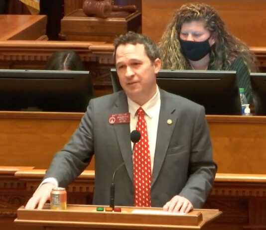 Georgia state Rep. Matt Dollar resigns from Legislature White man in gray suit and red tie speaking on Georgia House floor.