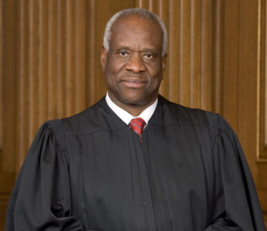 Lawmakers: Day 12 focuses on Clarence Thomas monument, ‘divisive’ curriculum in Senate Supreme Court Justice Clarence Thomas -black man with short grey hair with black judge gown and red tie.