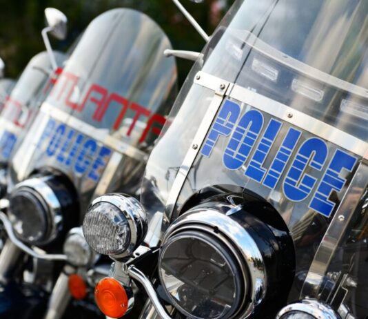 First responders’ mental injuries to remain uncompensable First responders no mental health compensation: Wind shields on Atlanta police motorcycles parked closely in a row
