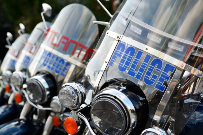 First responders no mental health compensation: Wind shields on Atlanta police motorcycles parked closely in a row