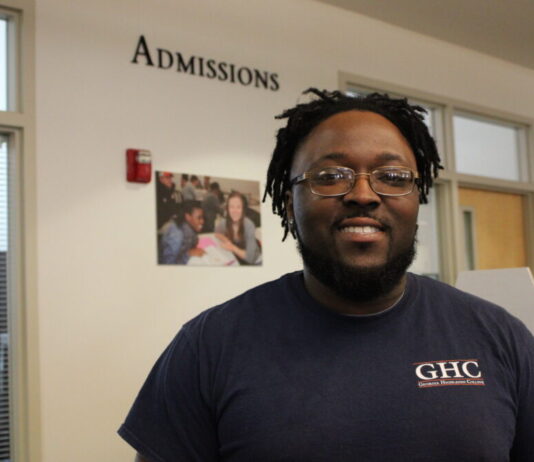 Accessing SAT and ACT exams presents challenges for Georgia high school students A black man with glasses wearing a GHC shirt