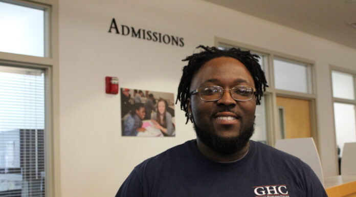 Accessing SAT and ACT exams presents challenges for Georgia high school students A black man with glasses wearing a GHC shirt