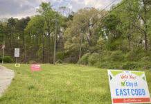Cobb officials prepare for four potential new cities Open field with a sign that says "Vote Yes! City of EAST COBB."