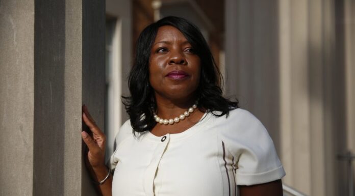 How popular merit scholarships have perpetuated racial inequities across the South Merit scholarship racial inequities: Black woman with long black hair wearing white top and pearl necklace looks to her left