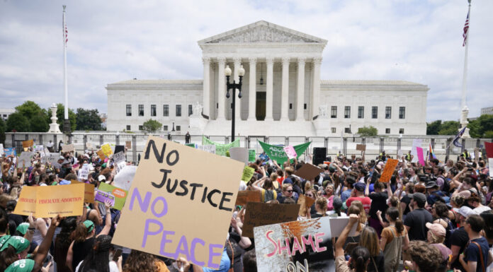 Supreme Court overturns Roe v. Wade; states can ban abortion U.S. Supreme Court building: Protesters gather outside the building with signs reading "no justice no peace" and "shame on the court"