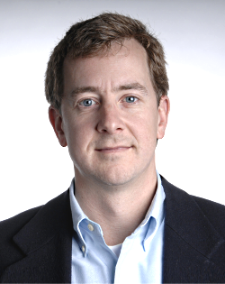Jeremy Redmon Man with light auburn hair wearing navy suit and light blue shirt