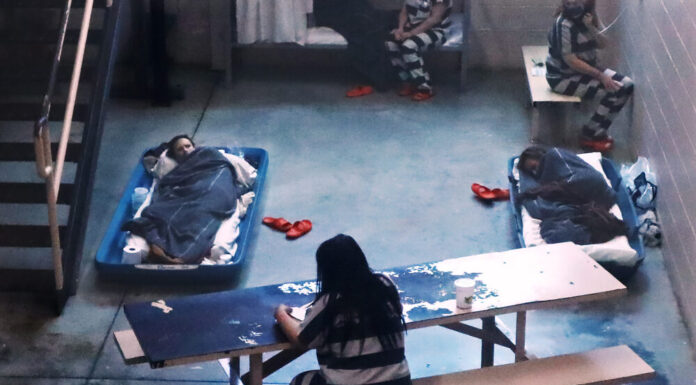 Investigation: The battle against COVID-19 in Georgia’s jails scene shot from above inside a jail cell with at least five female inmates