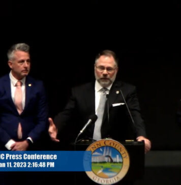 Largest federal indictment in history of Georgia’s Southern District charges 76 with drug conspiracy Four people at press conference in uniforms and suits black backdrop