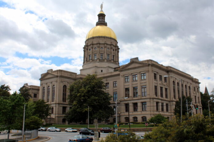 Wide shot of the Georgia state Capitol against a cloudy sky.