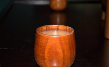 Kava bar makes waves for Atlanta’s sober curious community a close-up image of a round wooden cup filled with murky brown-grey liquid.