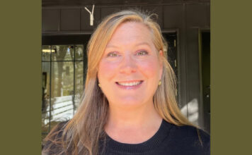 Everyday Hero: Animal lover’s nonprofit helps thousands of furry friends A profile photo of a blonde woman with long hair smiling at the camera. She is wearing a black sweater and small gold earrings. She is standing in front of a dark green building.
