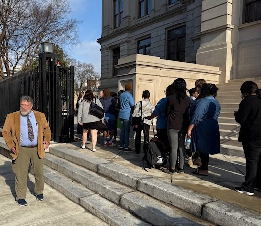 Meet Phil Lunney volunteer greeter at the Gold Dome Volunteer Phil Lunney greets visitors at the Georgia State Capitol on Thursday, Feb. 6, 2024 (Josh Azriel/Fresh Take Georgia).