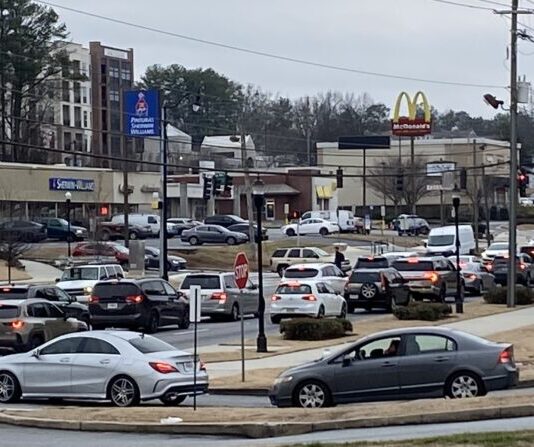 Georgia House considers bill revising driving rules for funeral motorcades Traffic on Peachtree Industrial Boulevard in Chamblee (Gabby Miller/Fresh Take Georgia).