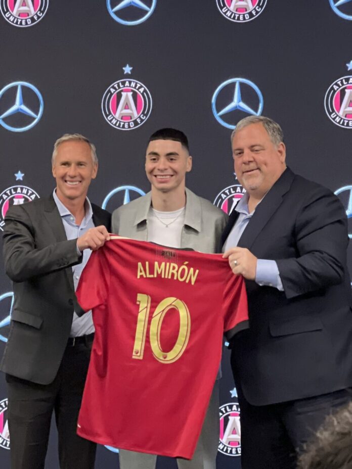 (Left to right) Chris Henderson, Miguel Almirón and Garth Lagerwey pose for a picture at Almirón’s introductory press conference (Henry Higuita Jr./Fresh Take Georgia).