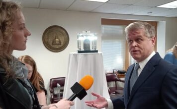 Religious groups visit Capitol to hand out Bibles to legislators Founder of the First American Bible Project, Stephen Skelton speaks in front of one of the original copies of the Robert Aitken Bible (Zaire Breedlove/Fresh Take Georgia).