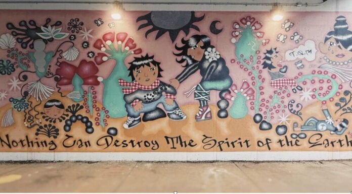 Painting the city with purpose: Living Walls’ fight for representation in Atlanta Karaoke Rodriguez’s “Nothing Can Destroy the Spirit of the Earth” on Arizona & DeKalb Avenue Hayley Schultz/Fresh Take Georgia).